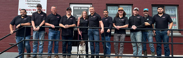 photo of the rocket supply team standing in front of their store